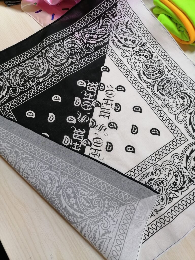 Bandana Edge Finishes Explained: Laser Cut, Merrowing, or Hemming? 4 Close-up of a Baby Hem on a Silk Scarf vs. a Merrowed Edge