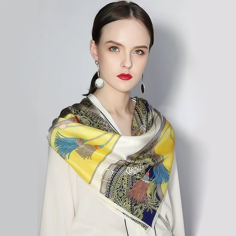 10 Chic Ways to Tie a Silk Scarf 4 A 90cm large square silk scarf tied in a traditional cowboy knot triangle drape over a blazer.