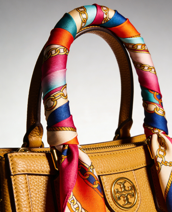 10 Chic Ways to Tie a Silk Scarf 10 luxury handbag handle wrapped with patterned silk scarf 1